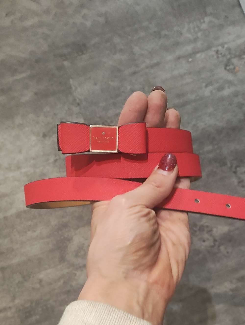 kate spade coral-red bow leather belt with gold buckle
